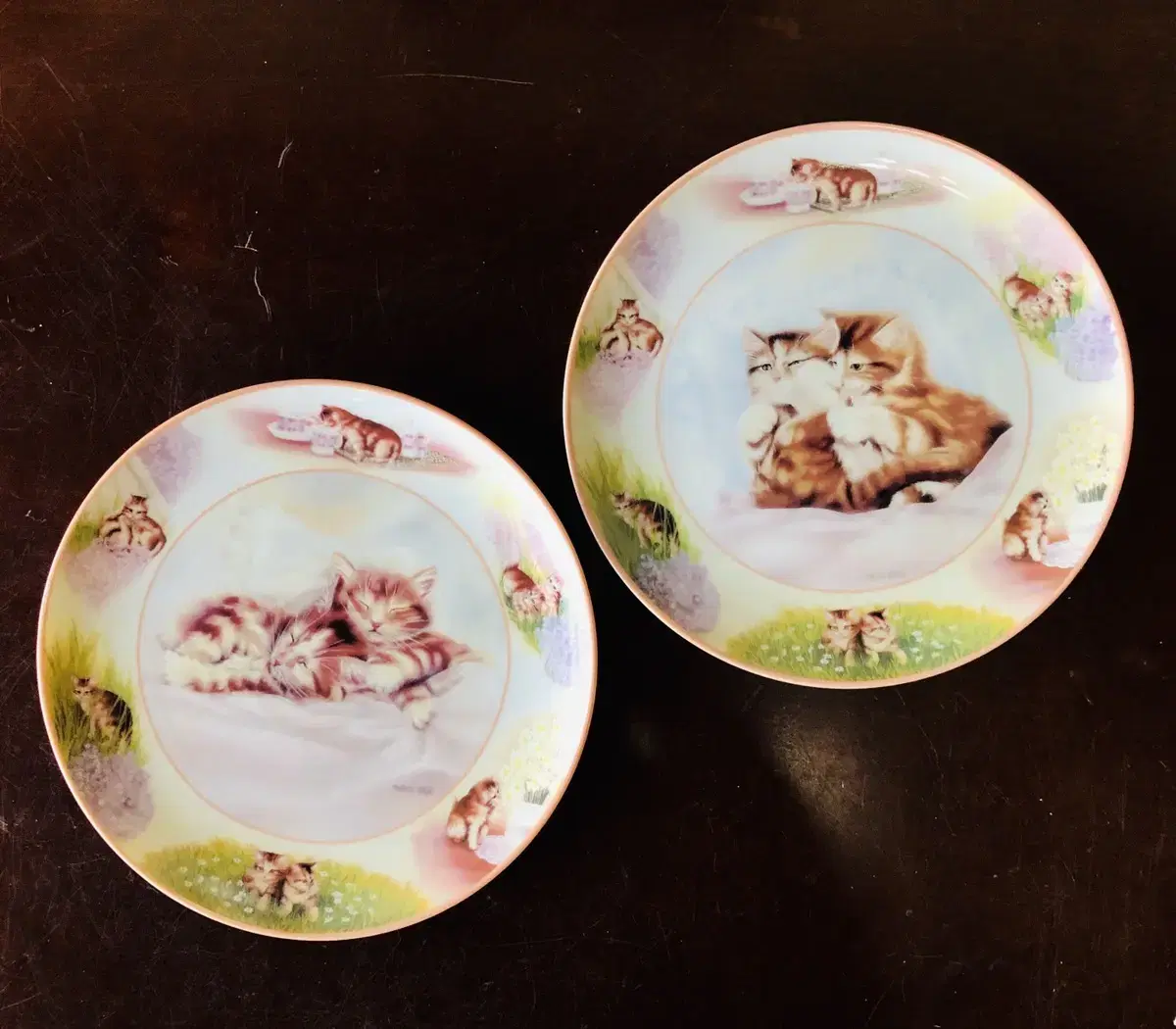 A set of two Bradex Kitty decorative plates from the United States