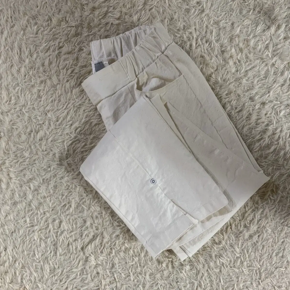 Two pairs of white pants