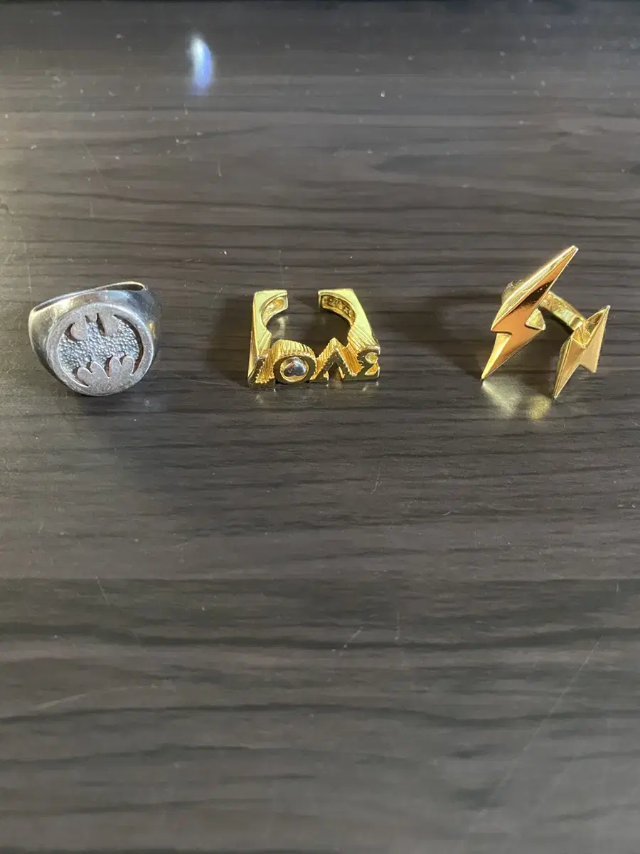 A set of three gold and silver rings