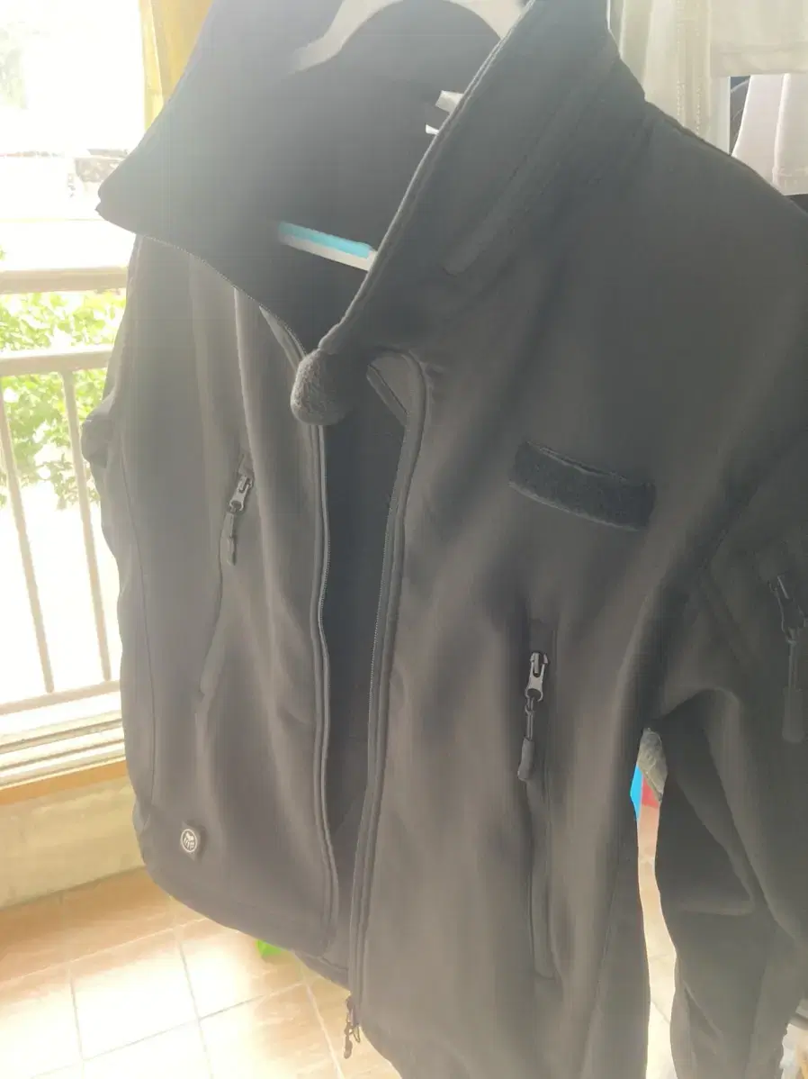 I'm selling a softshell jacket that's like new.