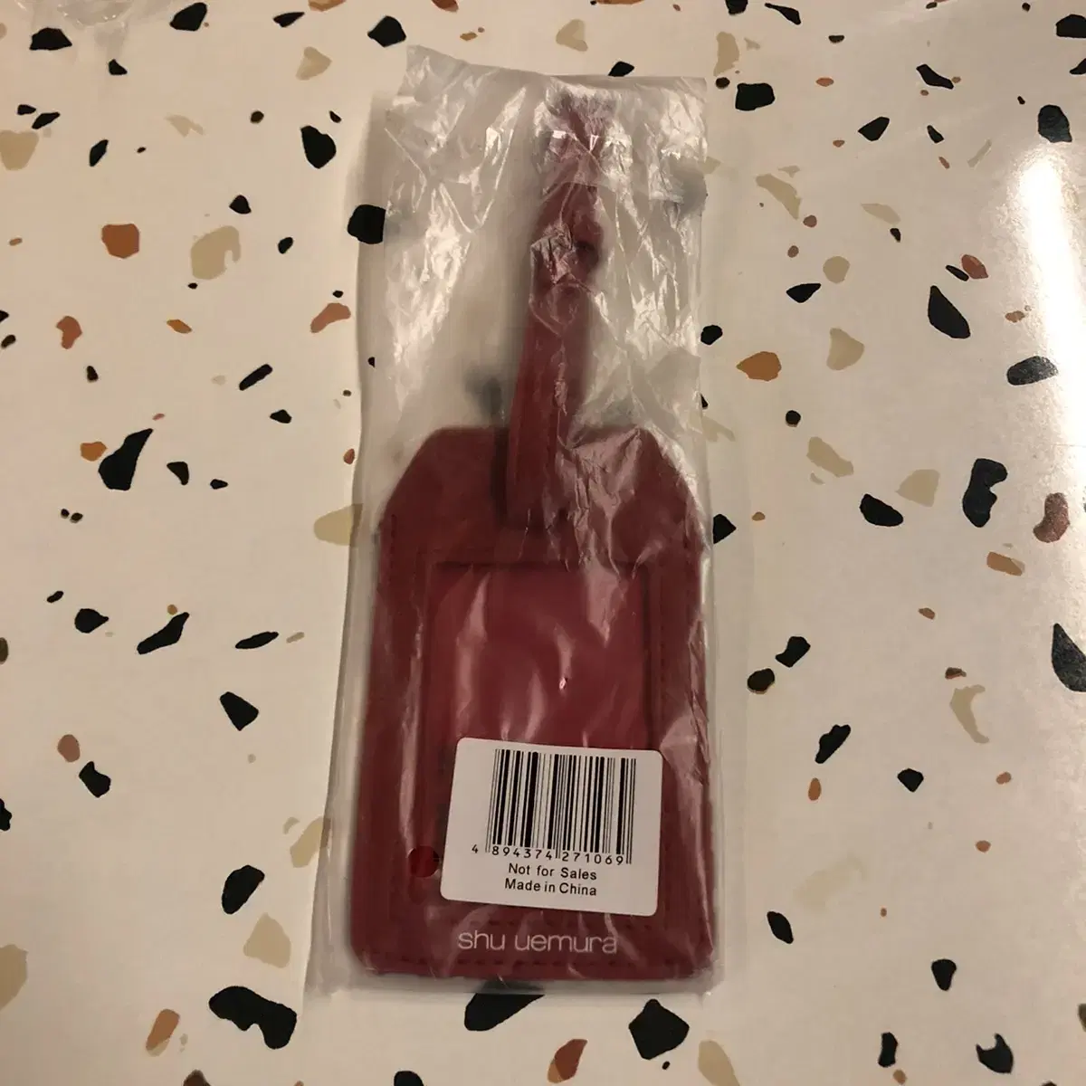 shu uemura luggage tag