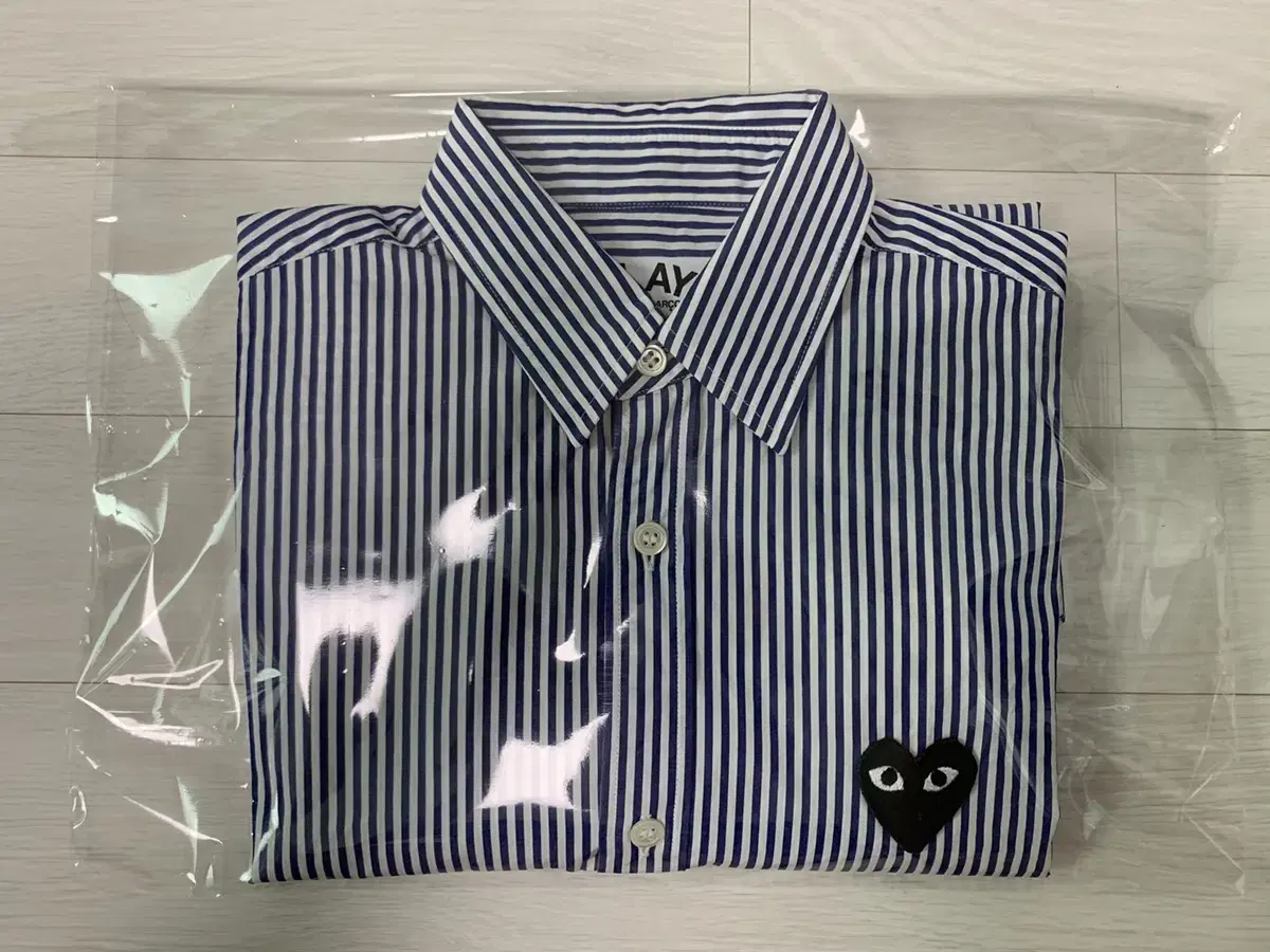 Sell me a bunch of Comme des Garçons striped shirts.