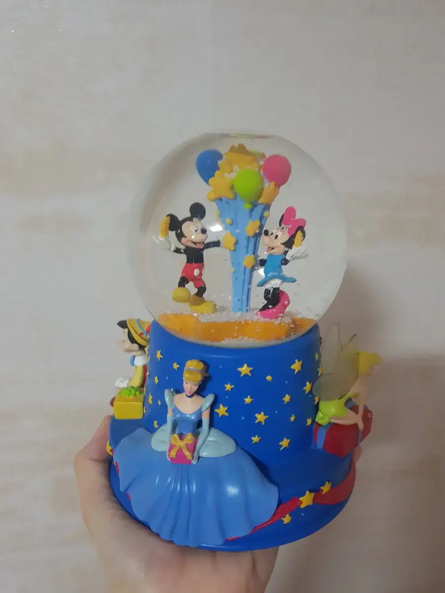 Disney sells Mickey Mouse and Minnie Mouse music boxes.