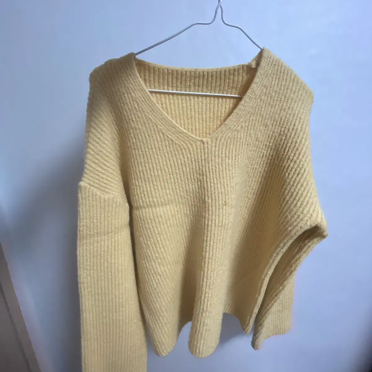 I'm selling a yellow V-neck knit