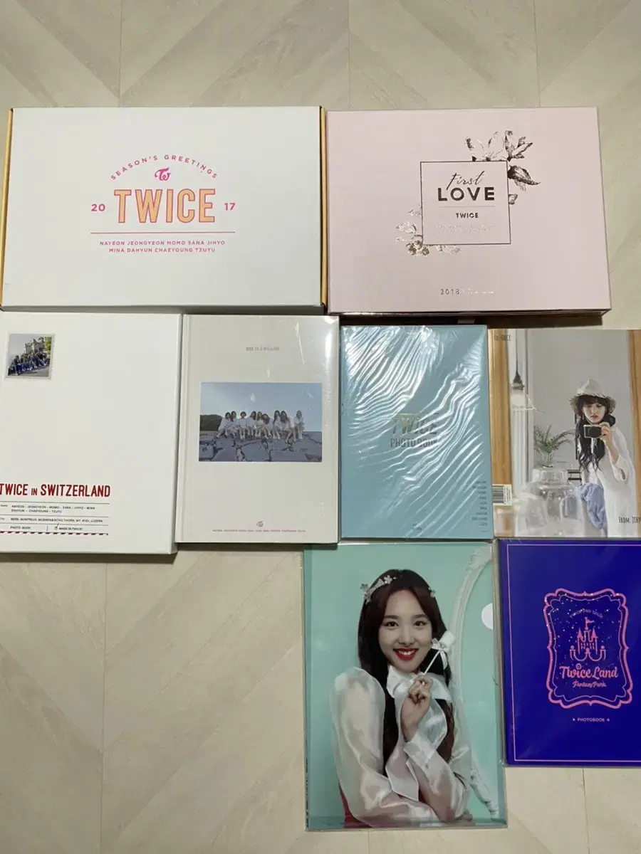 TWICE merchandise (photobooks, season's greetings, concert merchandise, posters)