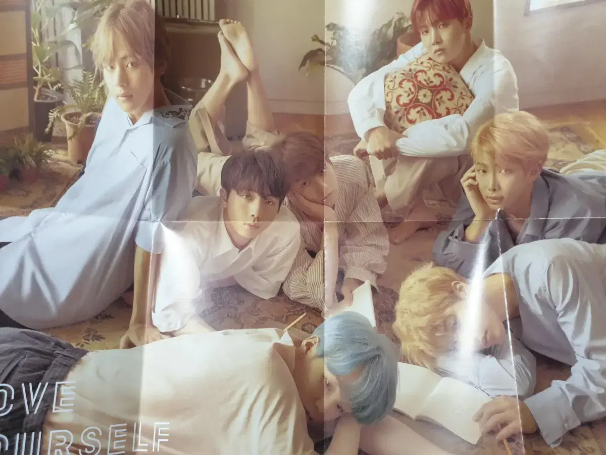 BTS poster (folded through the paper)