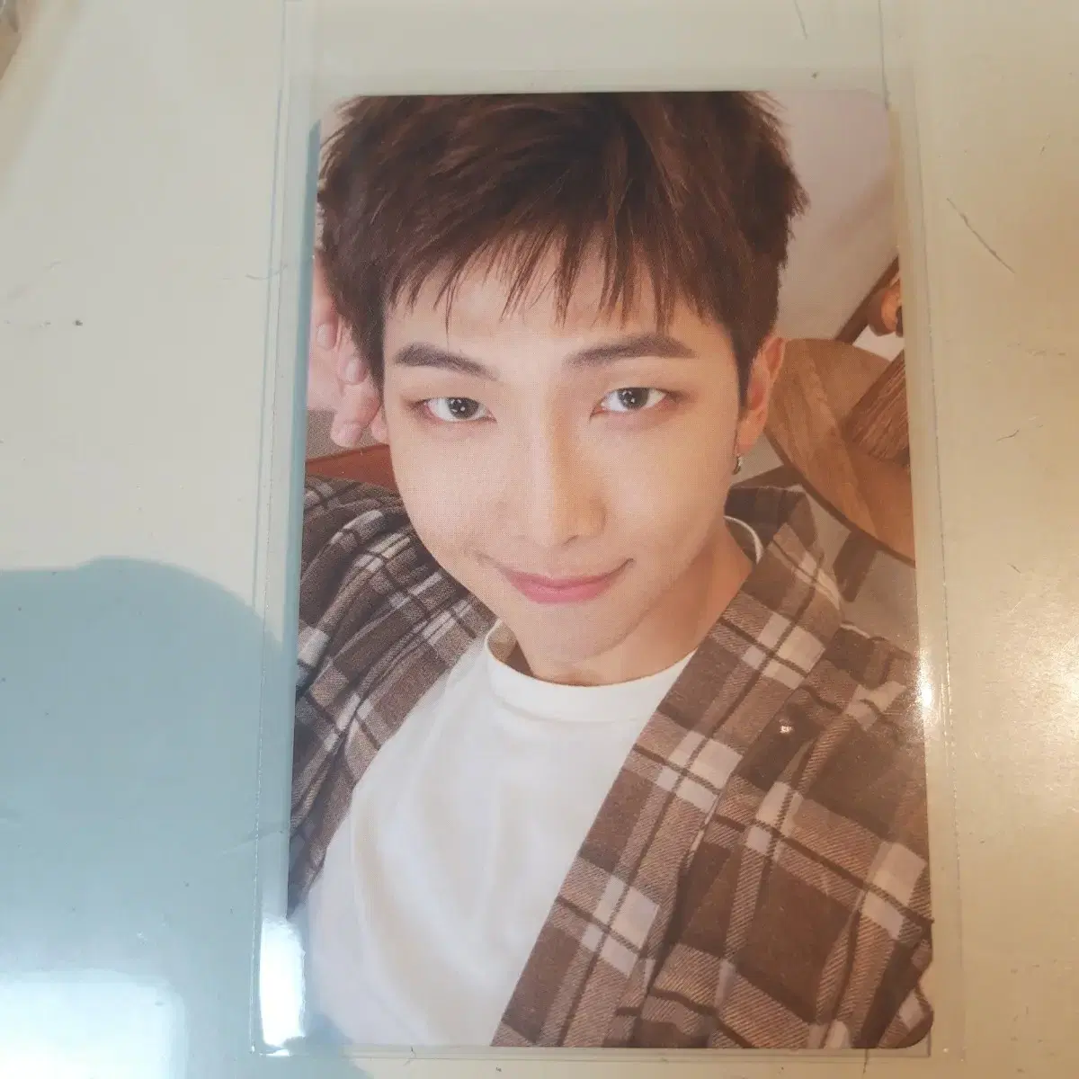 BE Essentials album photocard sold by Jun Nam