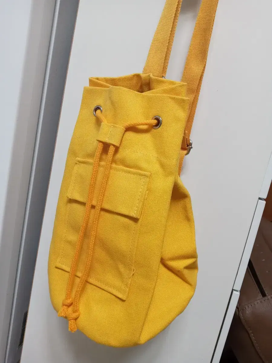 New. Canvas cloth bag.Yellow color.