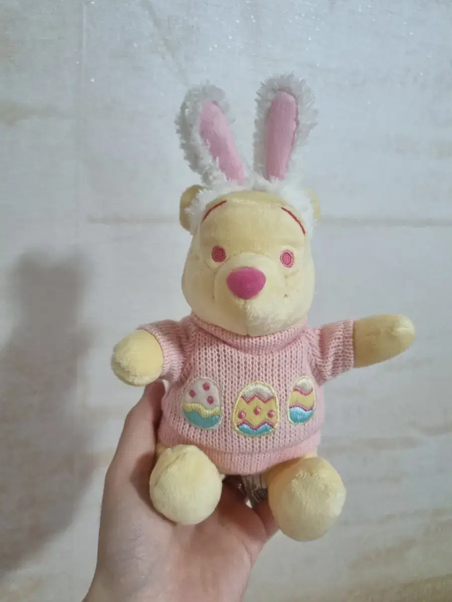 Sell Disney Easter Pooh dolls.