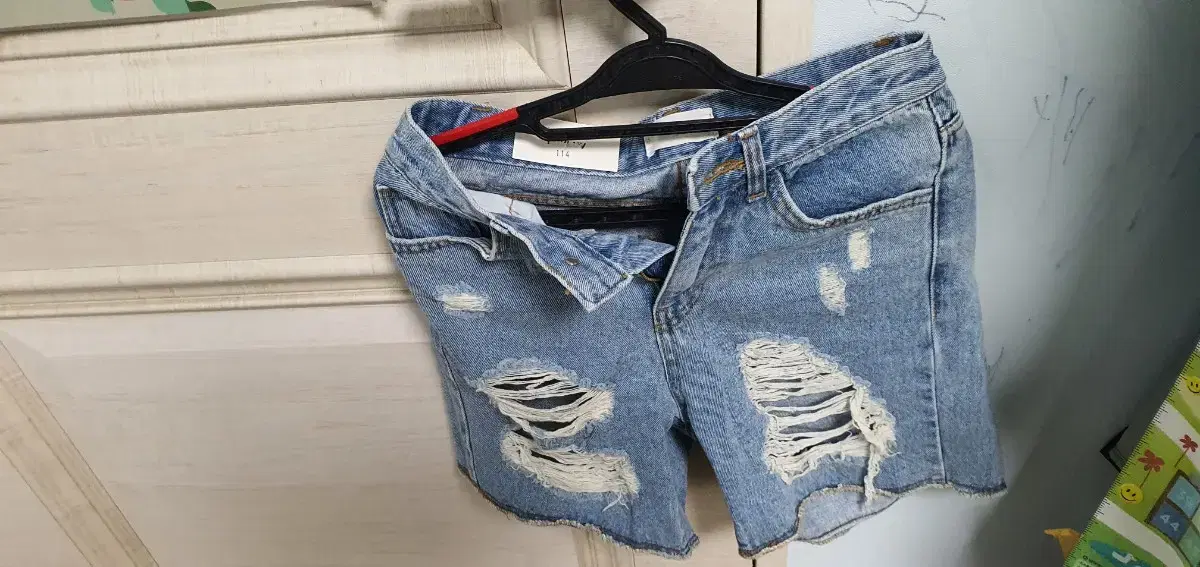 (Organizing the closet) ripped jeans and shorts