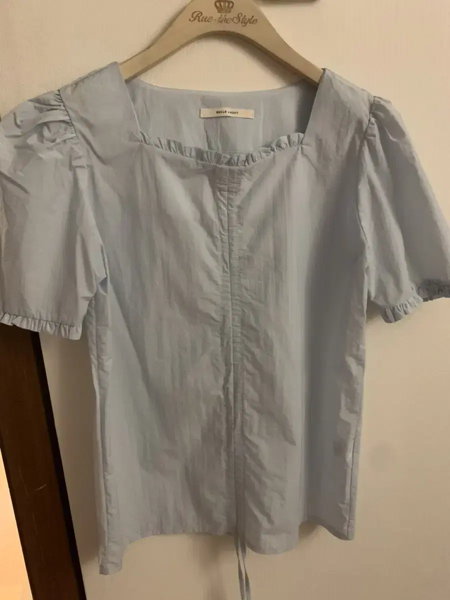 A light blue blouse