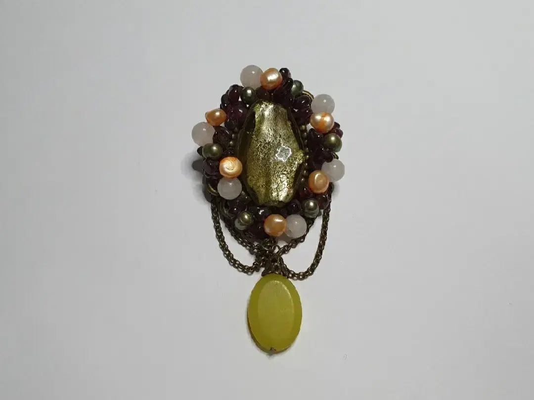 Raw stone brooch