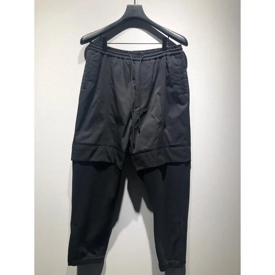 (Size 48) JUNJ / Bottom hem layered pants