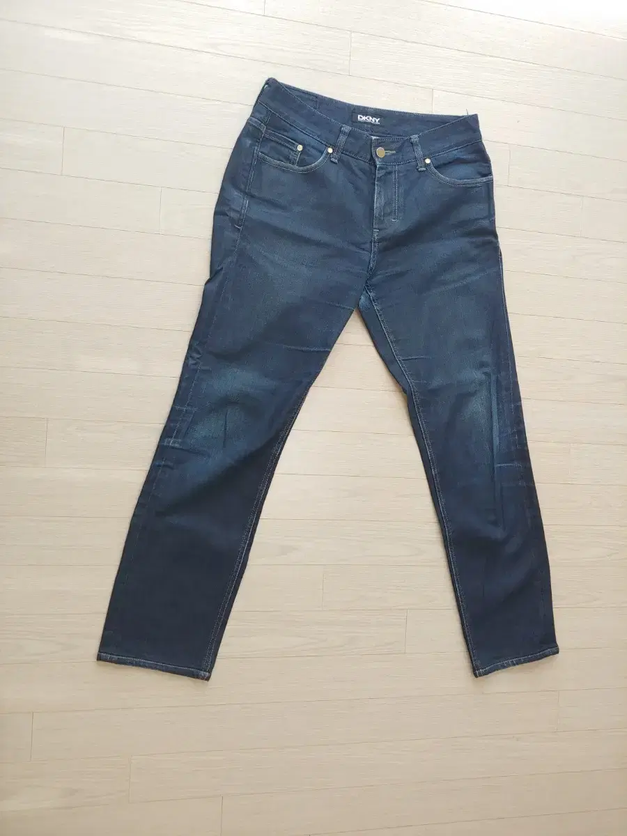 I have a pair of men's DKNY jeans, size 86, for sale.