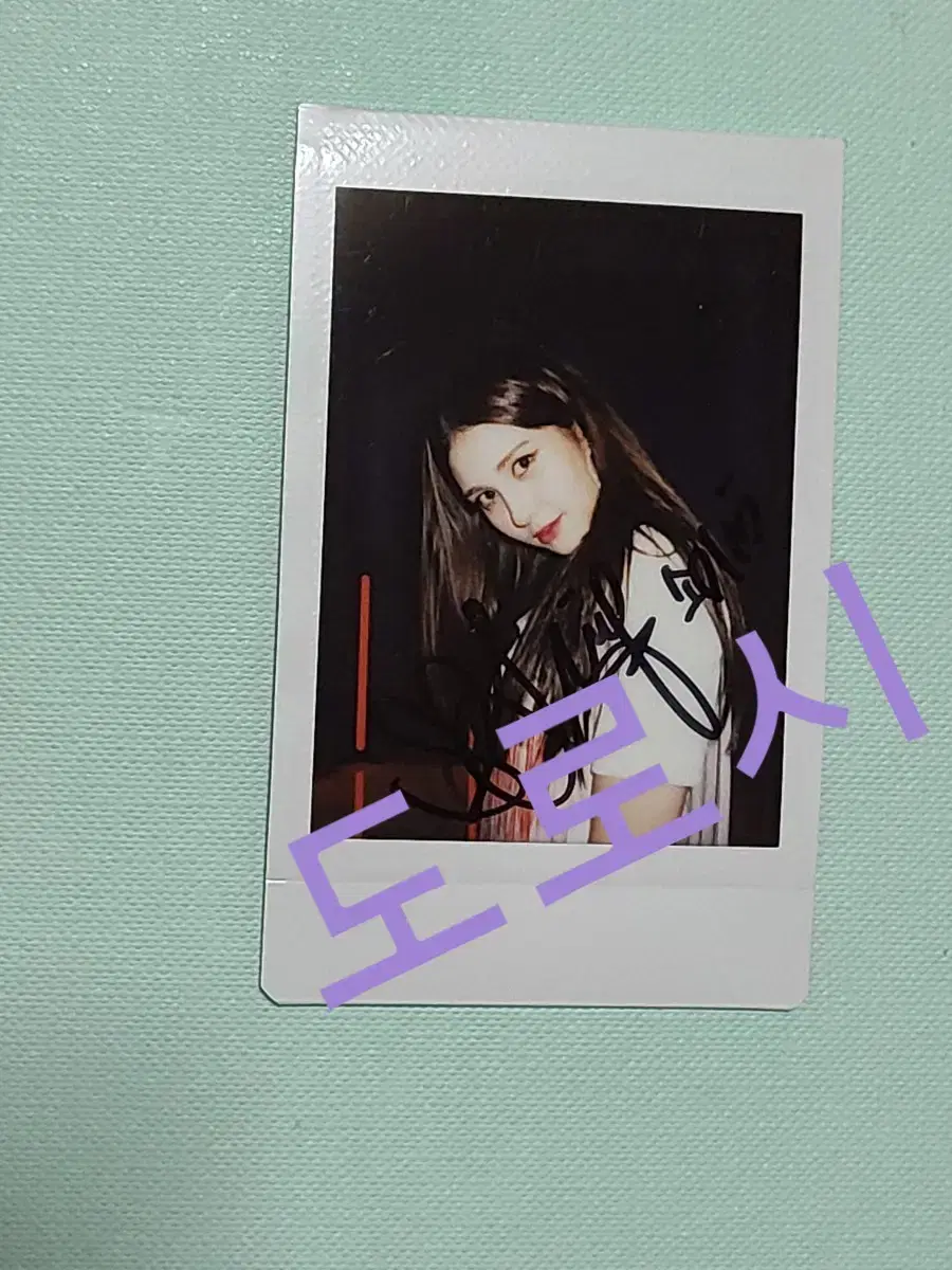 Written by Jeon Somi sign polaroid 