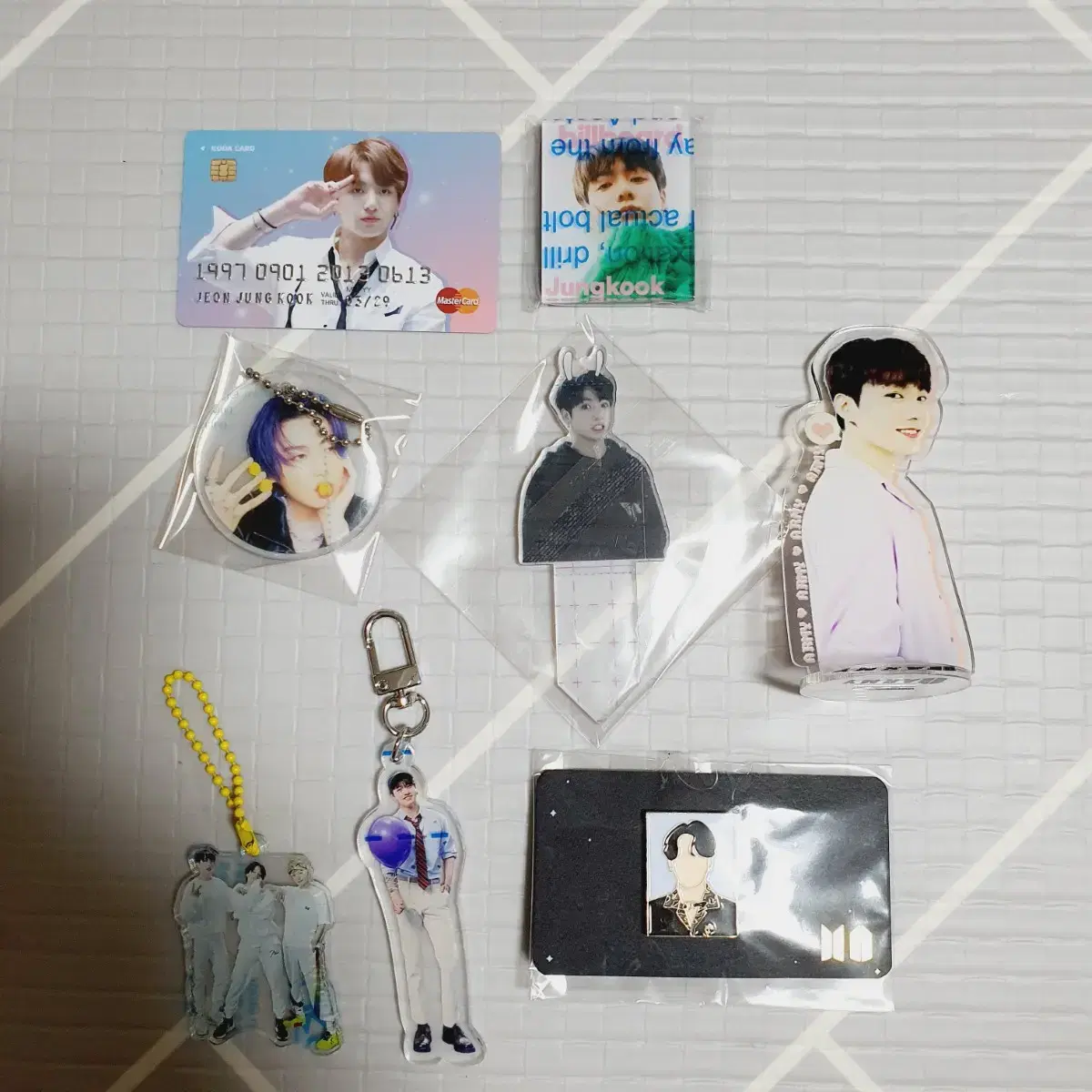 Bulk of 8 Jungkook acrylic, keyrings, magnets, and badges