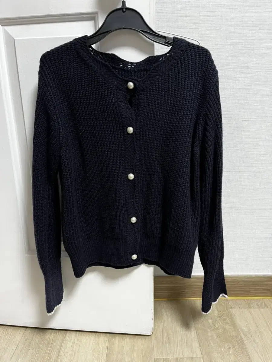 Navy-colored pearl cardigan