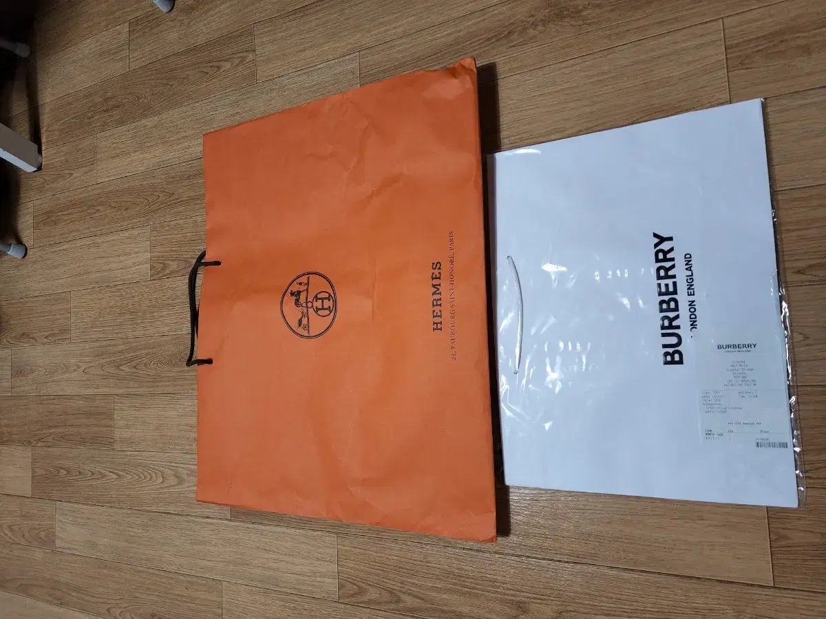 Hermès paper bag (60 cm) + Burberry paper bag sealed (42 cm)