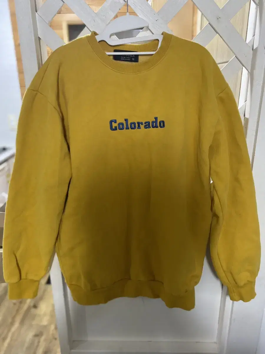 Mustard-colored sweatshirt