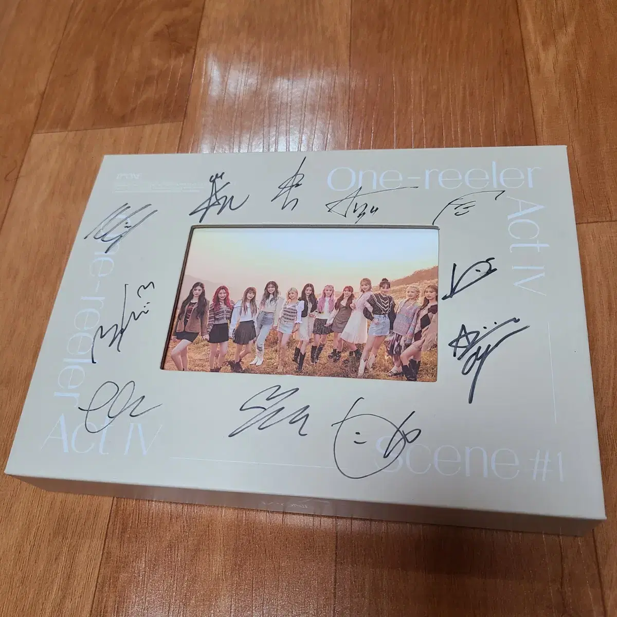 iz*one one-reeler album signed by all members