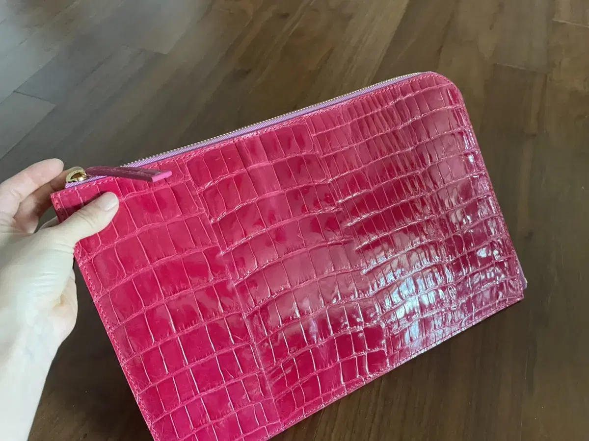 Glossy clutch in real crocodile leather