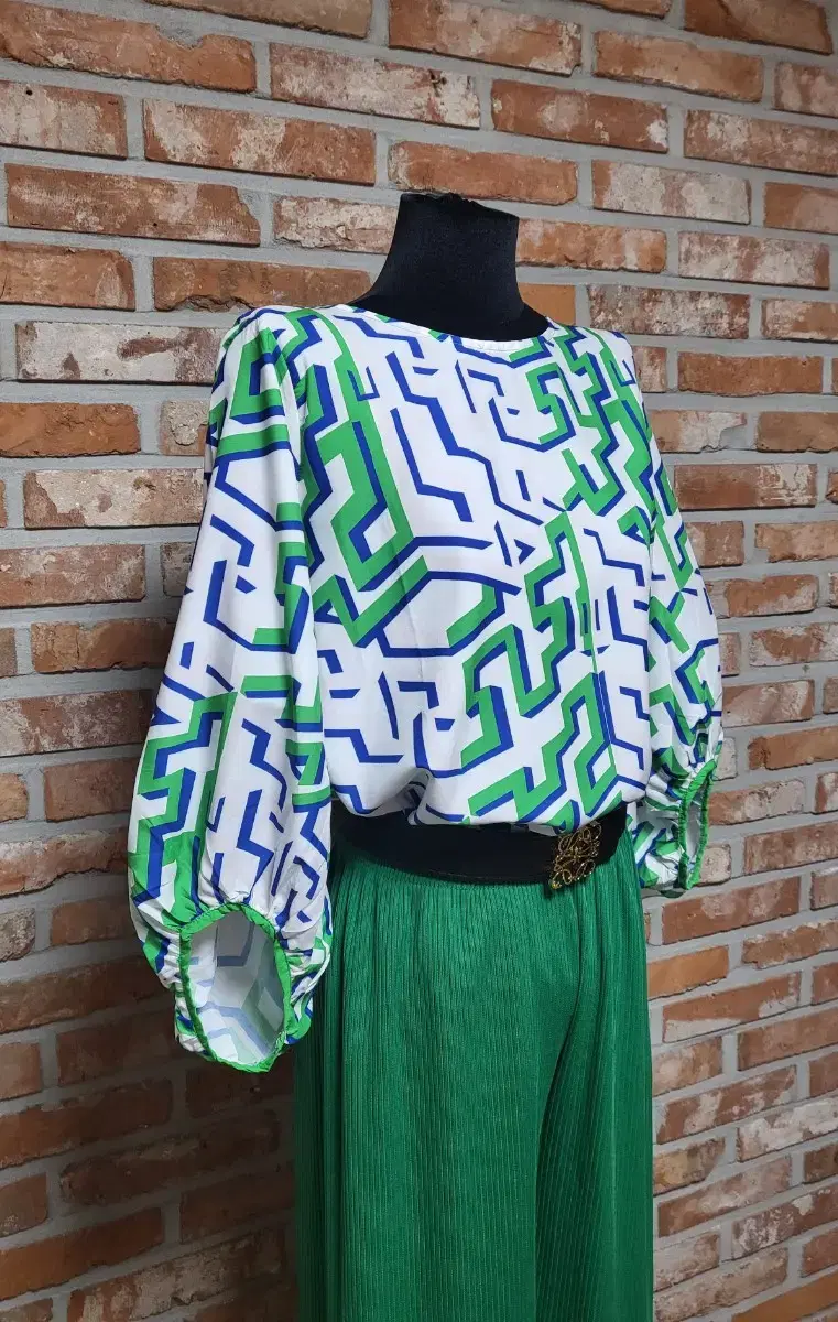 Geometric patterned green blouse