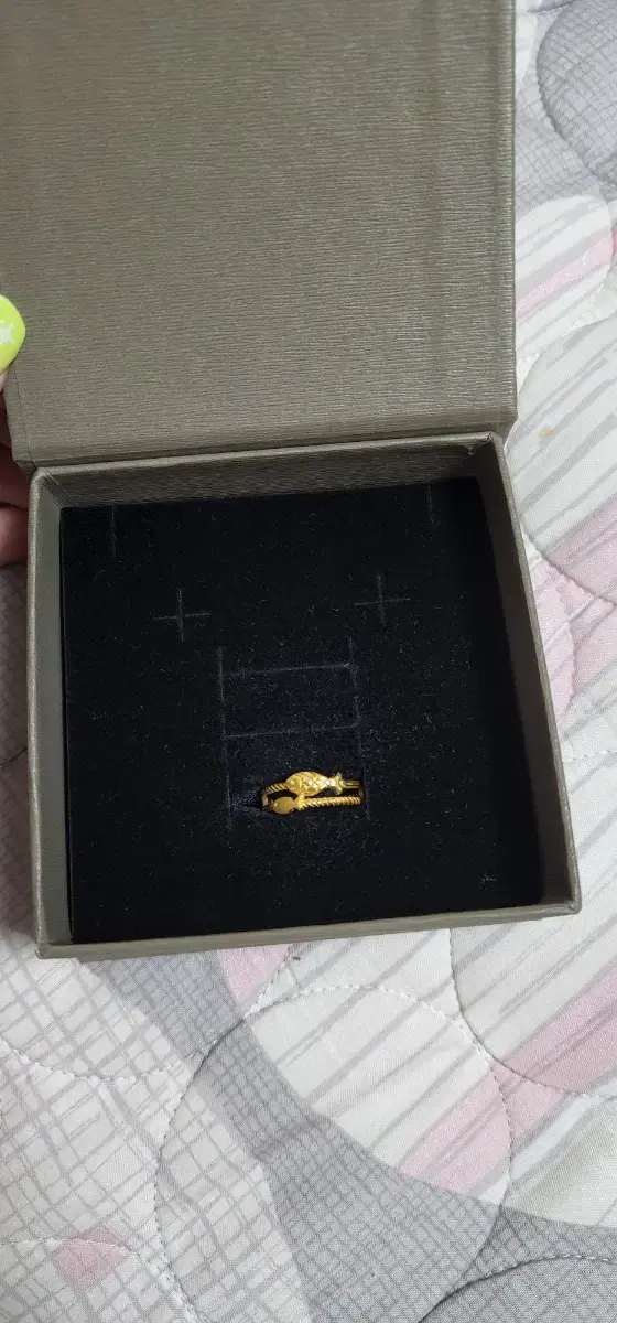 This is a solid gold fish ring.