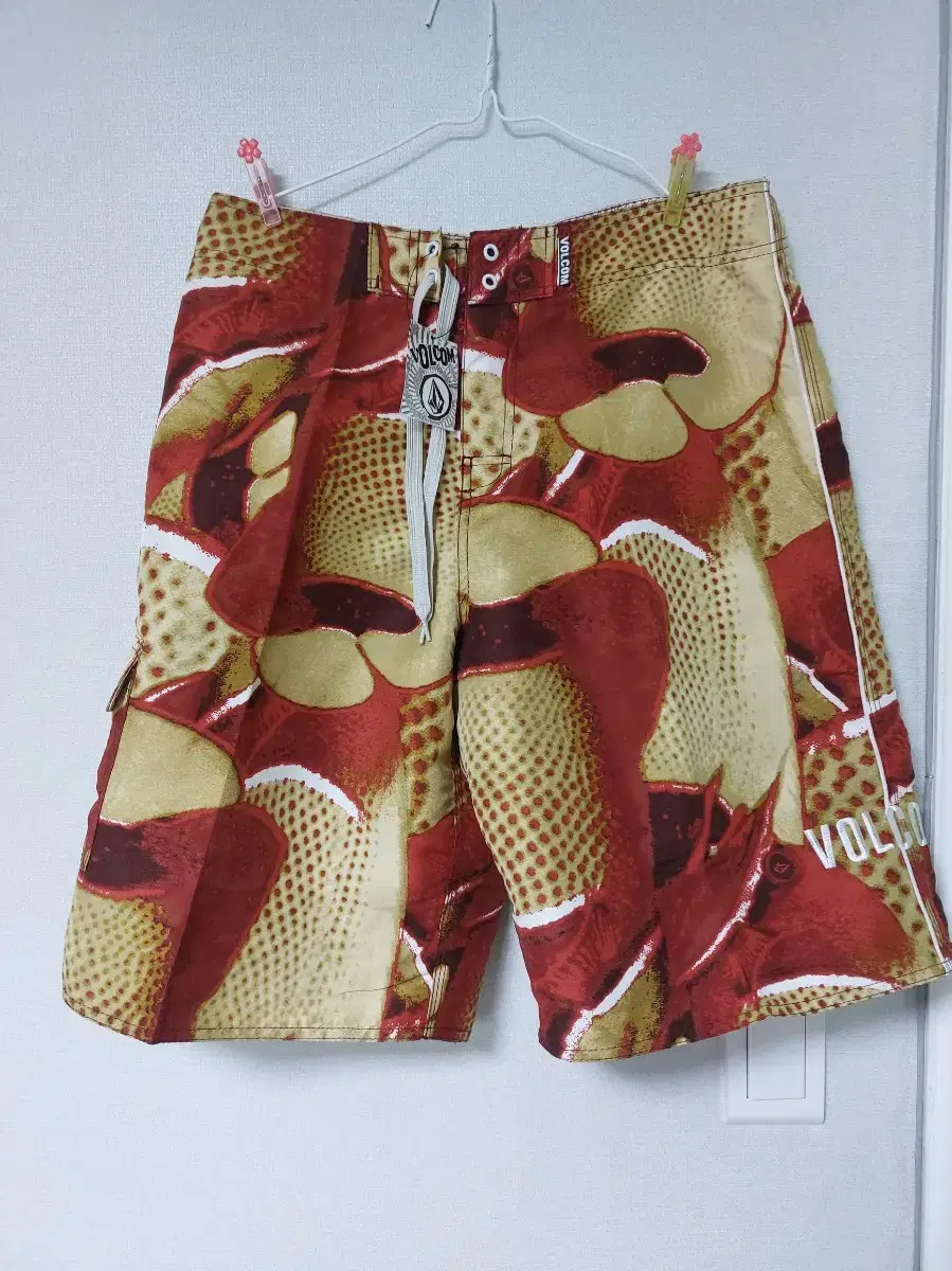 New) Volcom board, beach pants size 34