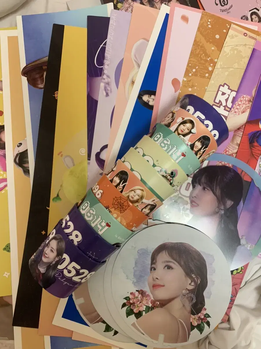 Twice unofficial goods (paper slogans, cup holders, fans)