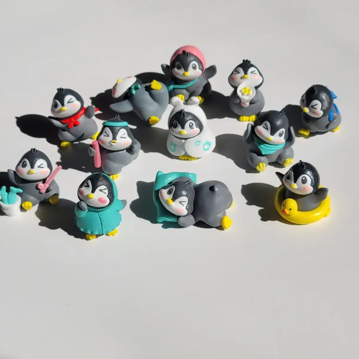 Collection of 12 penguin figures