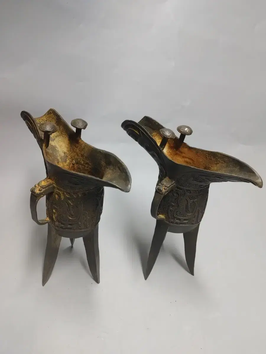 Two bronze sake cups from the past