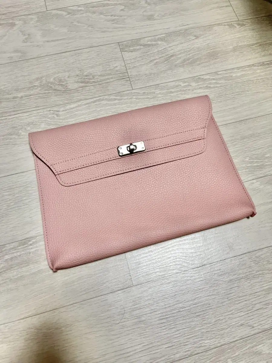 I'm selling my new pink clutch.