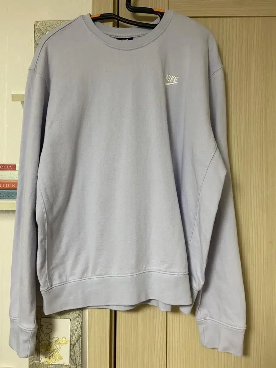 [L] Nike's light purple sweatshirt is on sale.