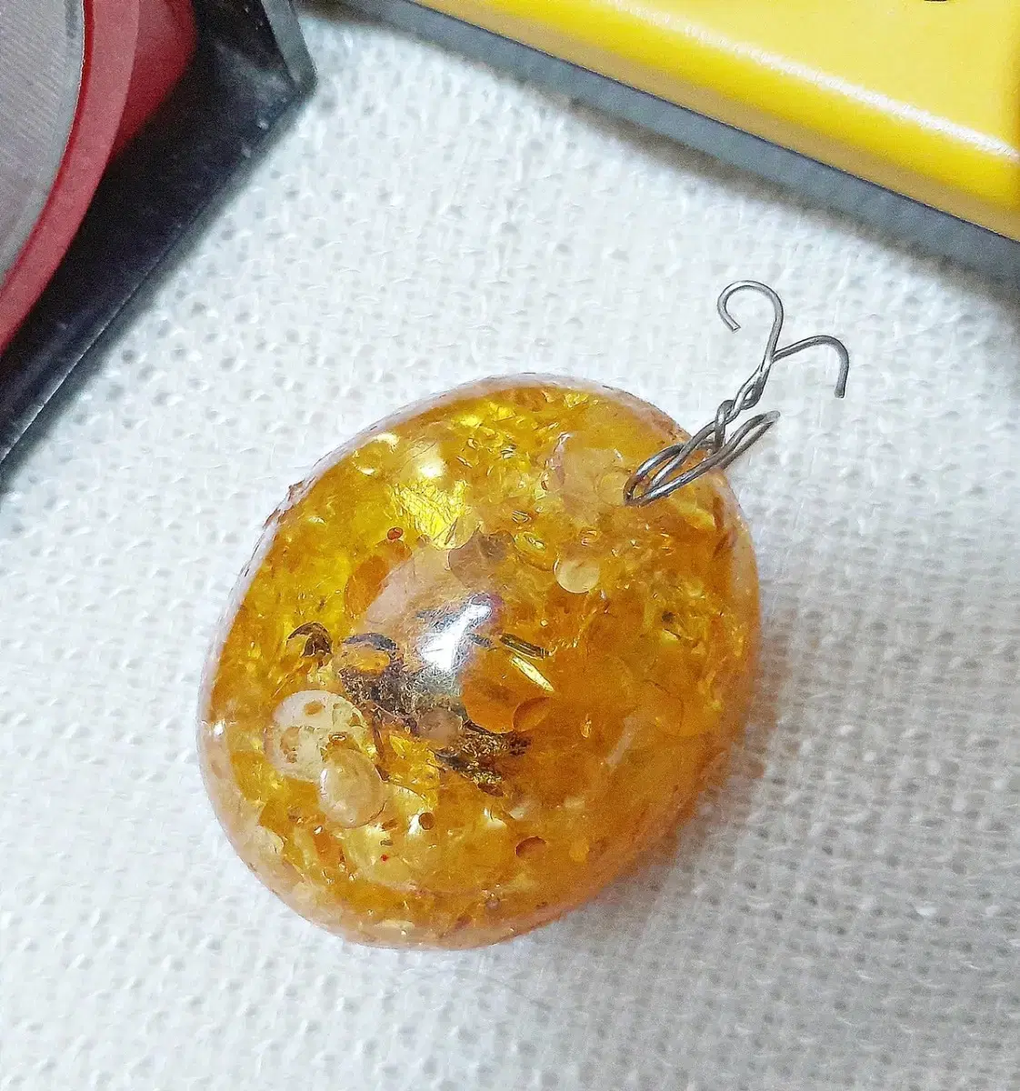 Silver pendant with a bee on a pumpkin