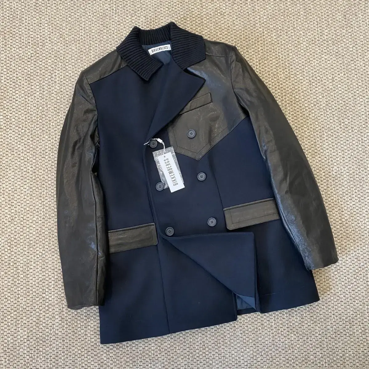 BIKKEMBERGs Italian top-grain lambskin and virgin wool double coat.