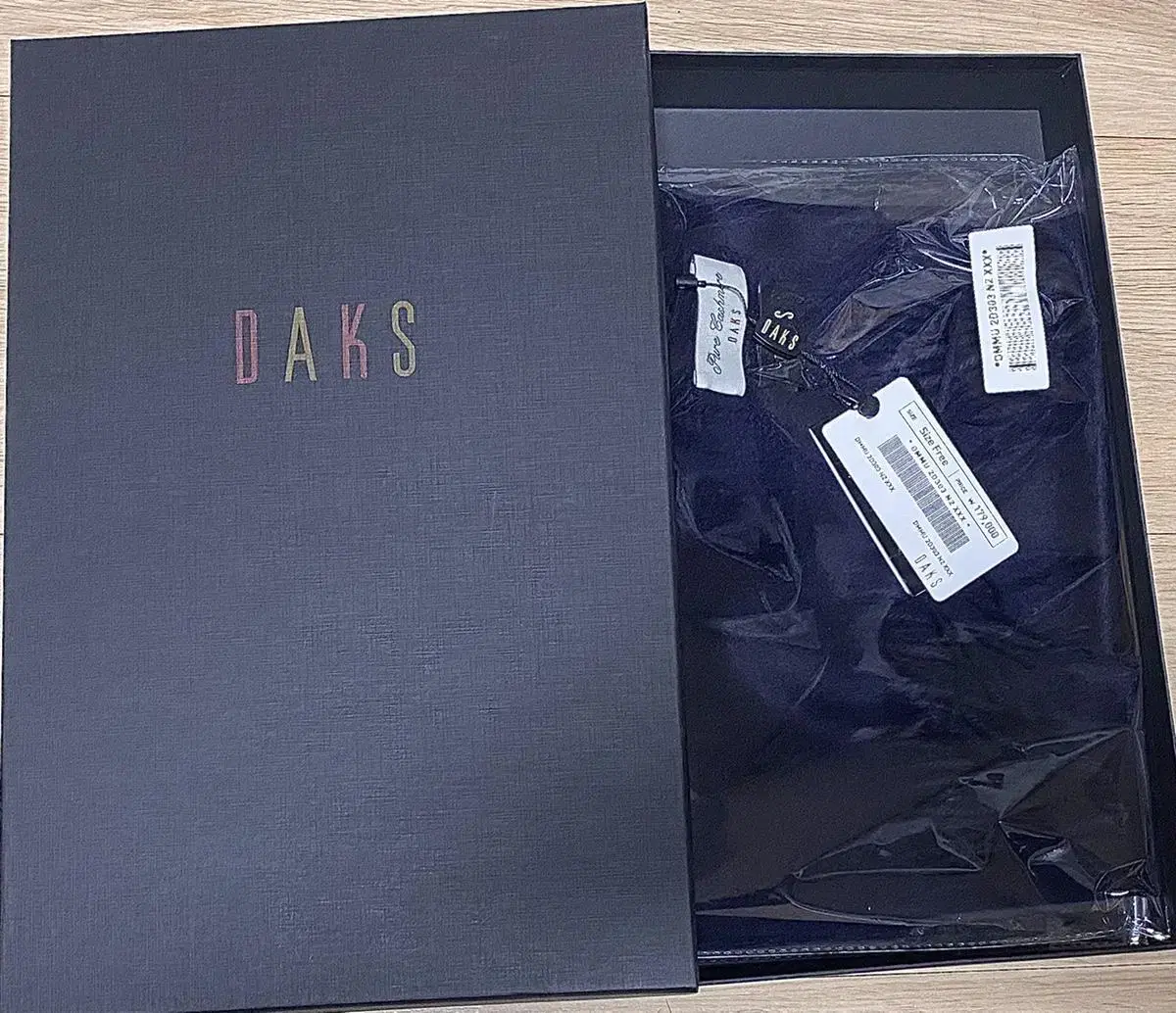 sealed, a genuine Daks cashmere scarf, for sale