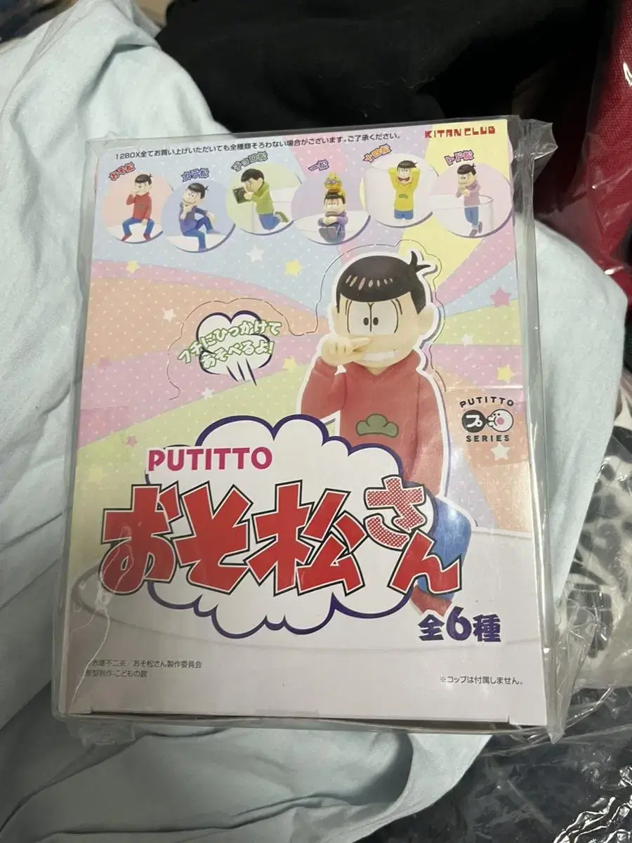 Osomatsu-san on a cup putitto figure