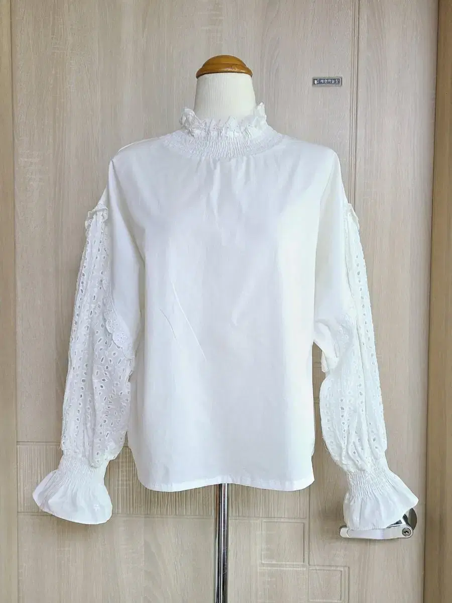 White eyelet embroidered blouse