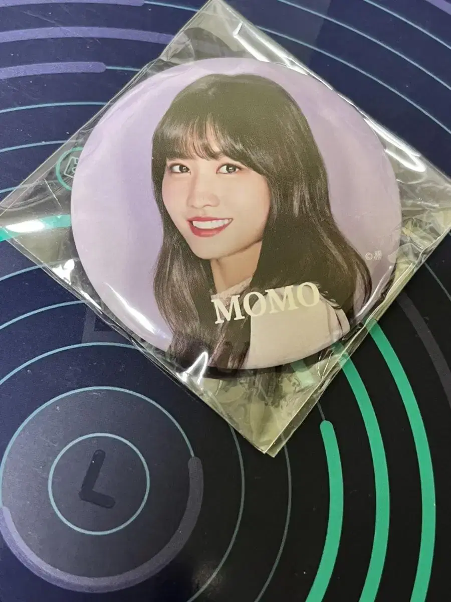 Twice momo to sell badges