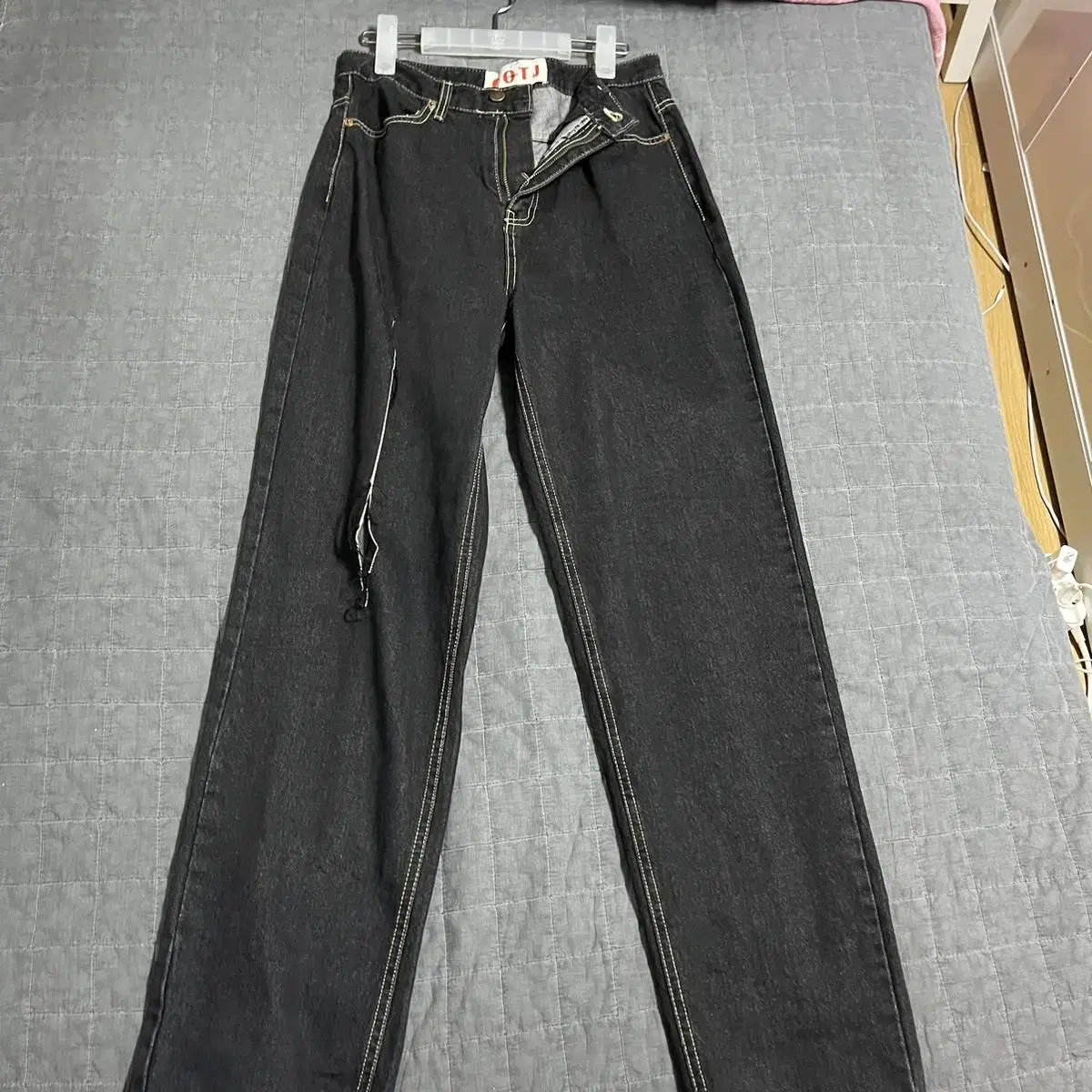 Black jeans with vertical slits