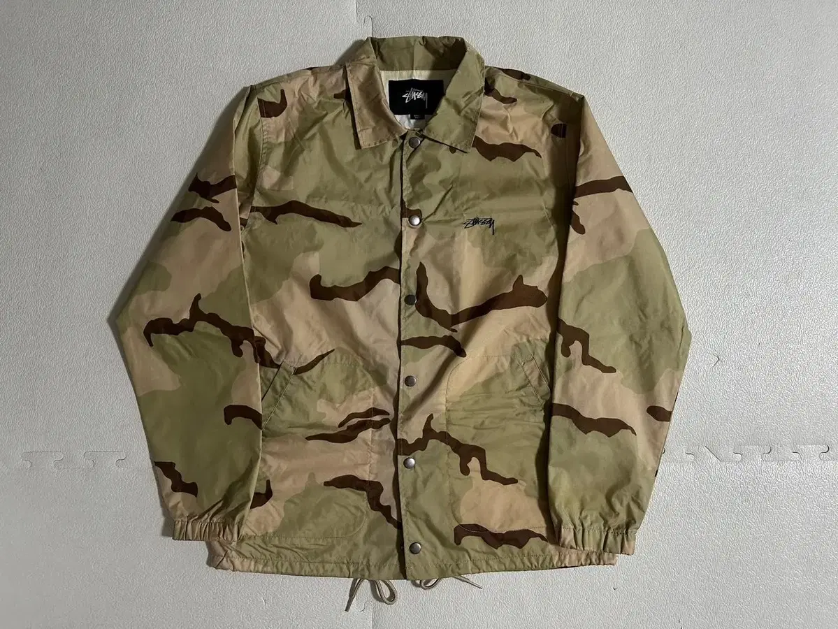 Stussy's Desert 3-Color Coach Jacket is on sale.