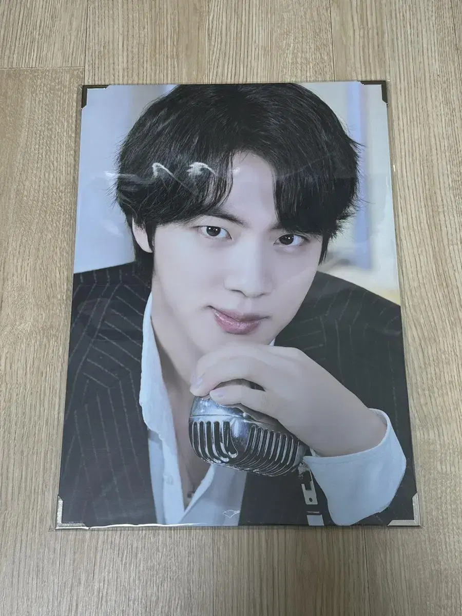 BTS jin sells premium photos.