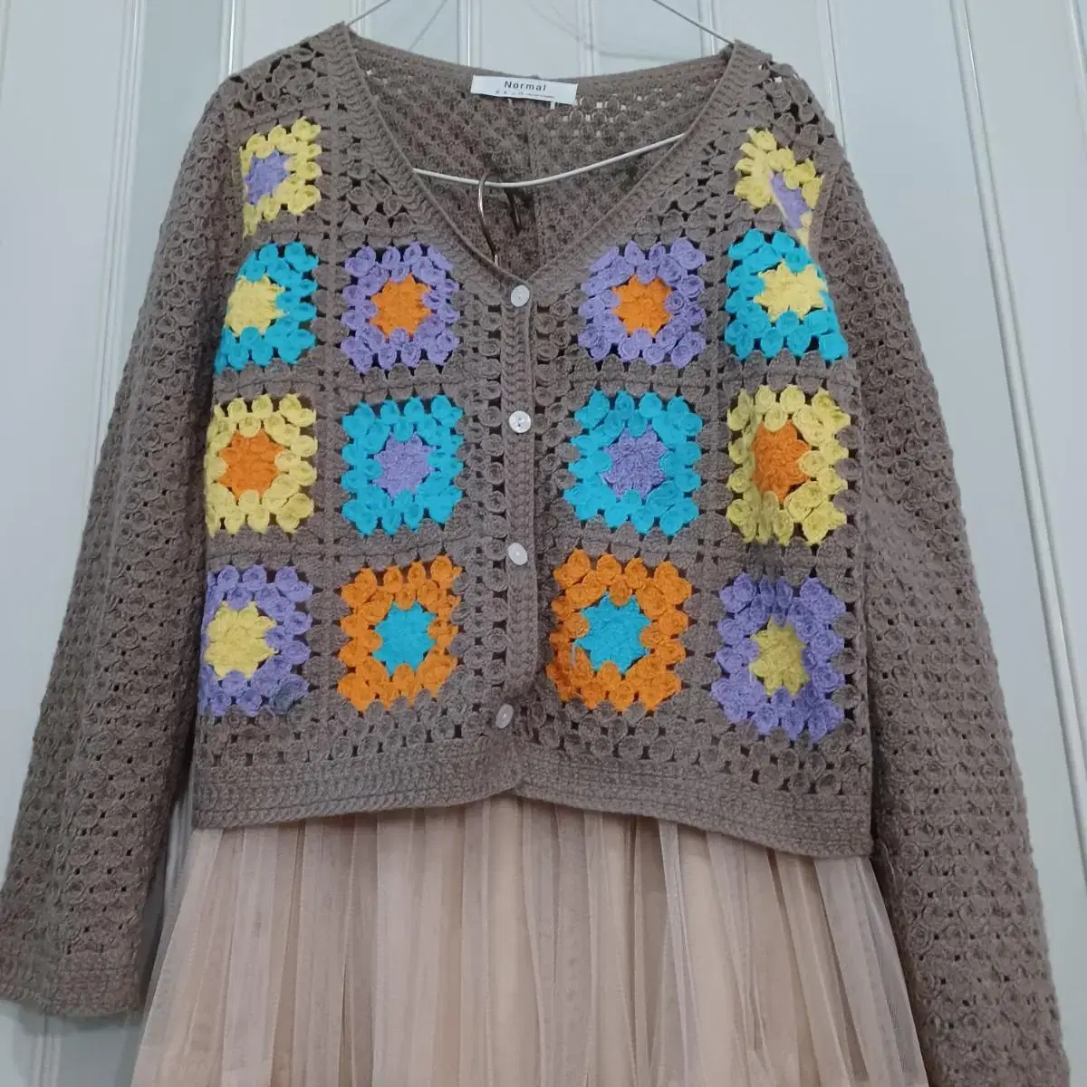 Knit cardigan with square motif not worn