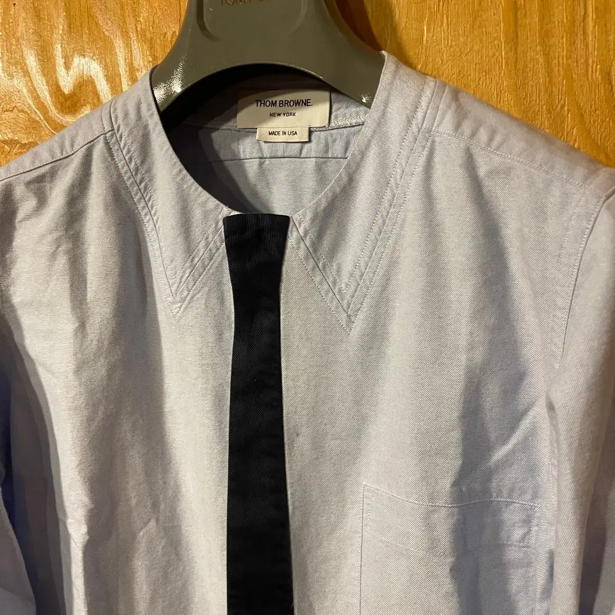 Thom Browne faux tie shirt sell.