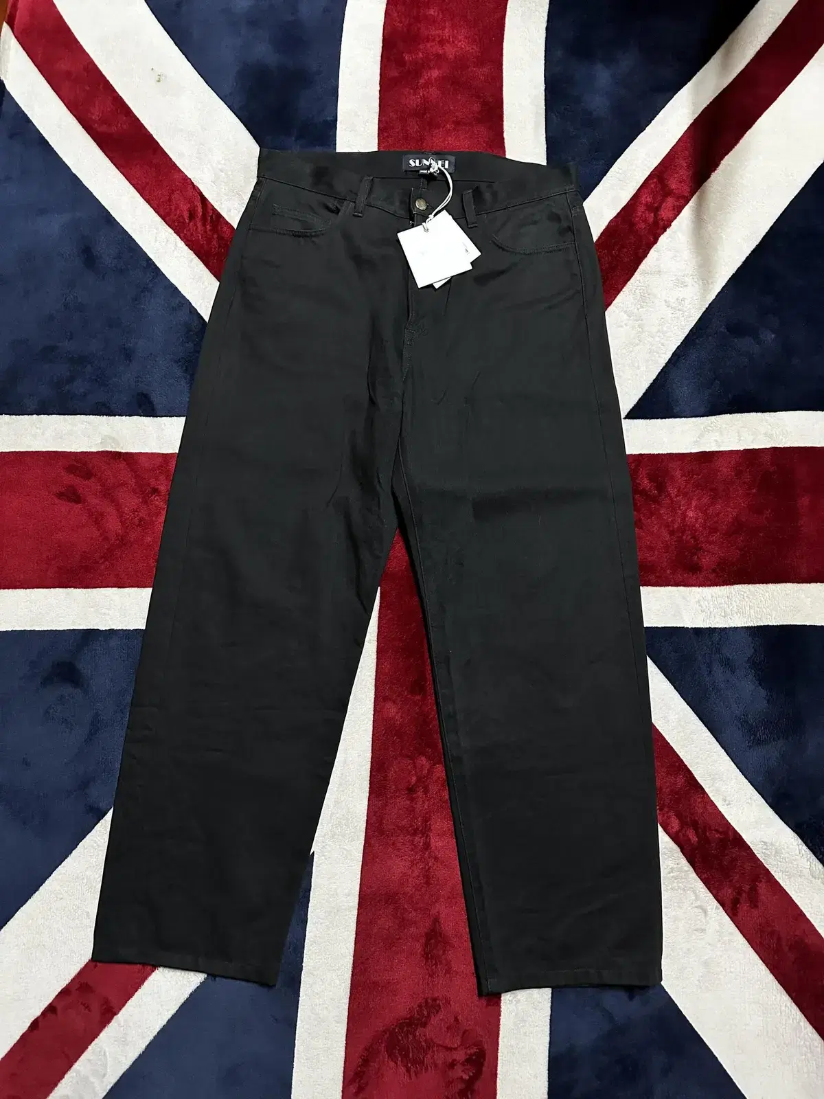 I'm selling a pair of sunray/black jeans, size L, brand new.