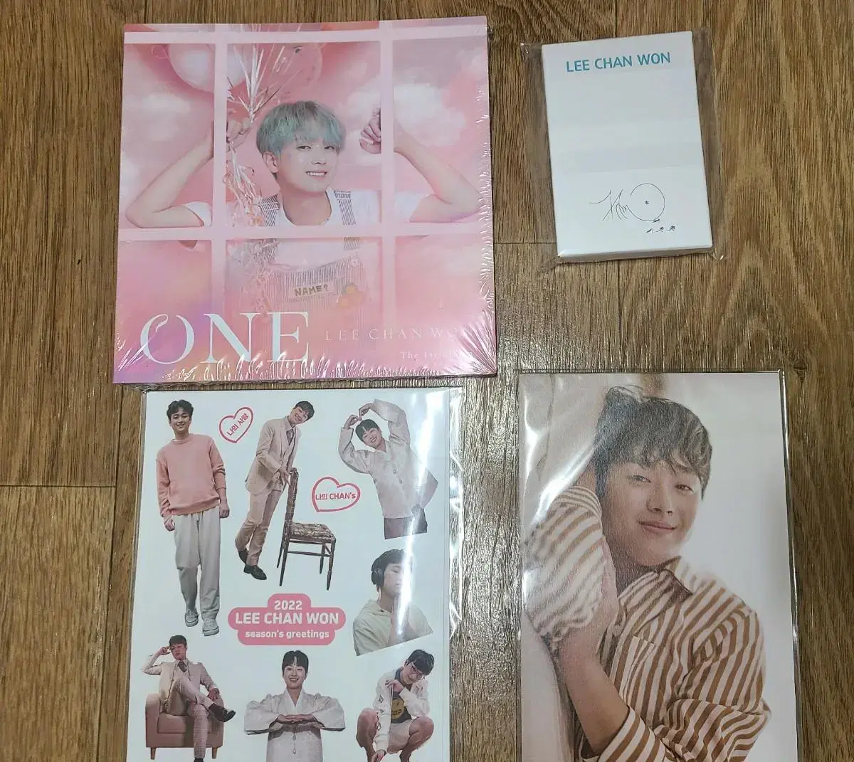 Unsealed Lee Chan Won albums and merchandise.