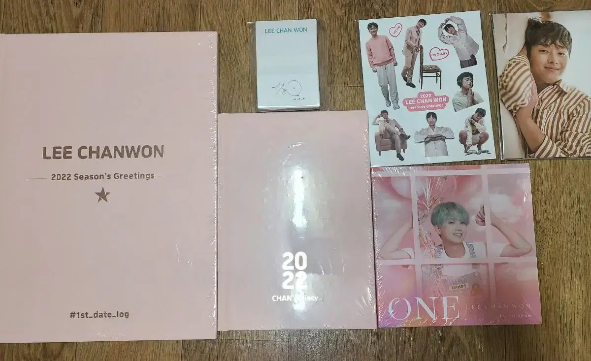 Unsealed Lee Chan Won albums and merchandise.