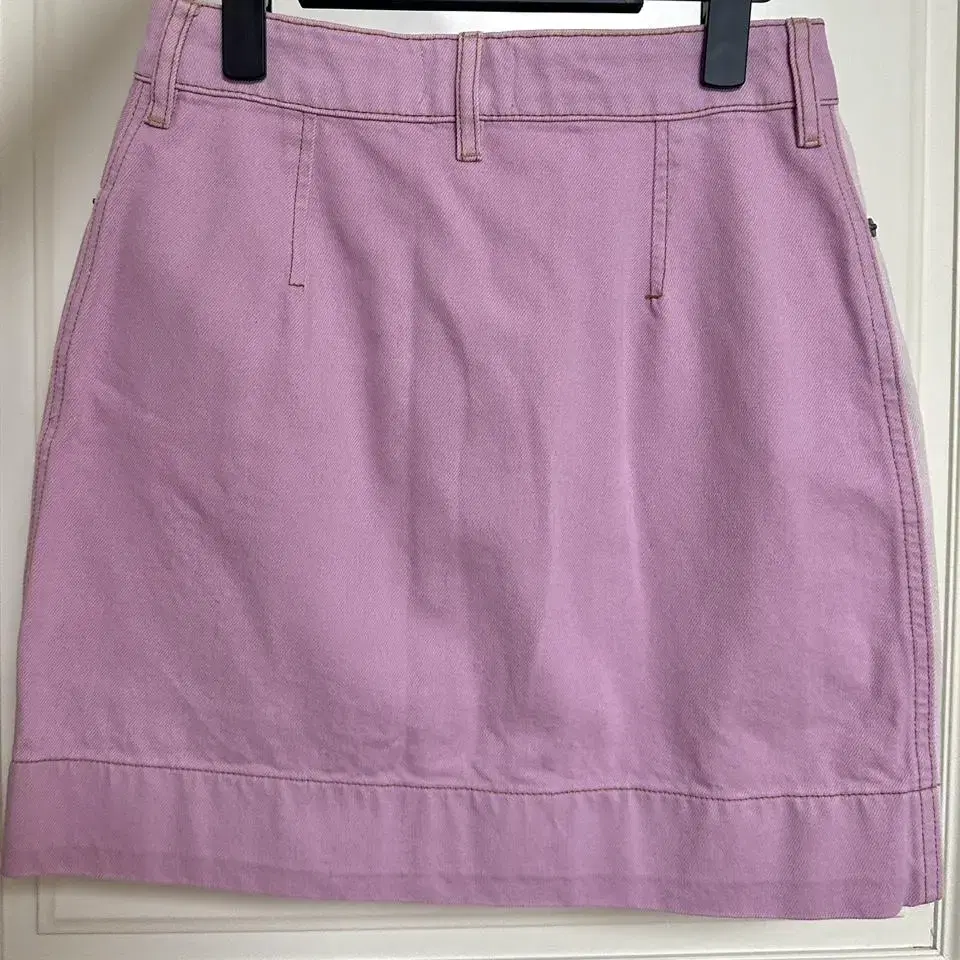 GANNI 가니 WAVE BUTTON SKIRT LIGHT PINK