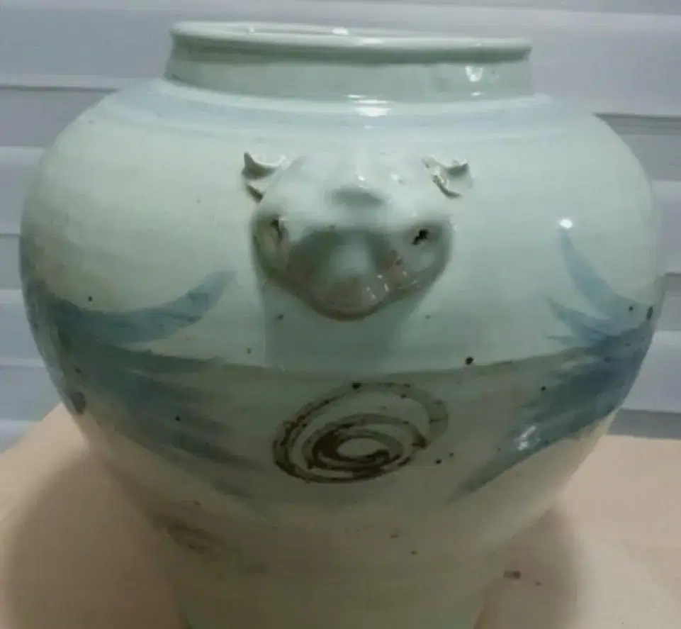 It is a zuu jar with a three-dimensional pattern.