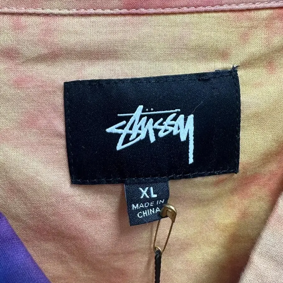 stussy tie dye orange shirt